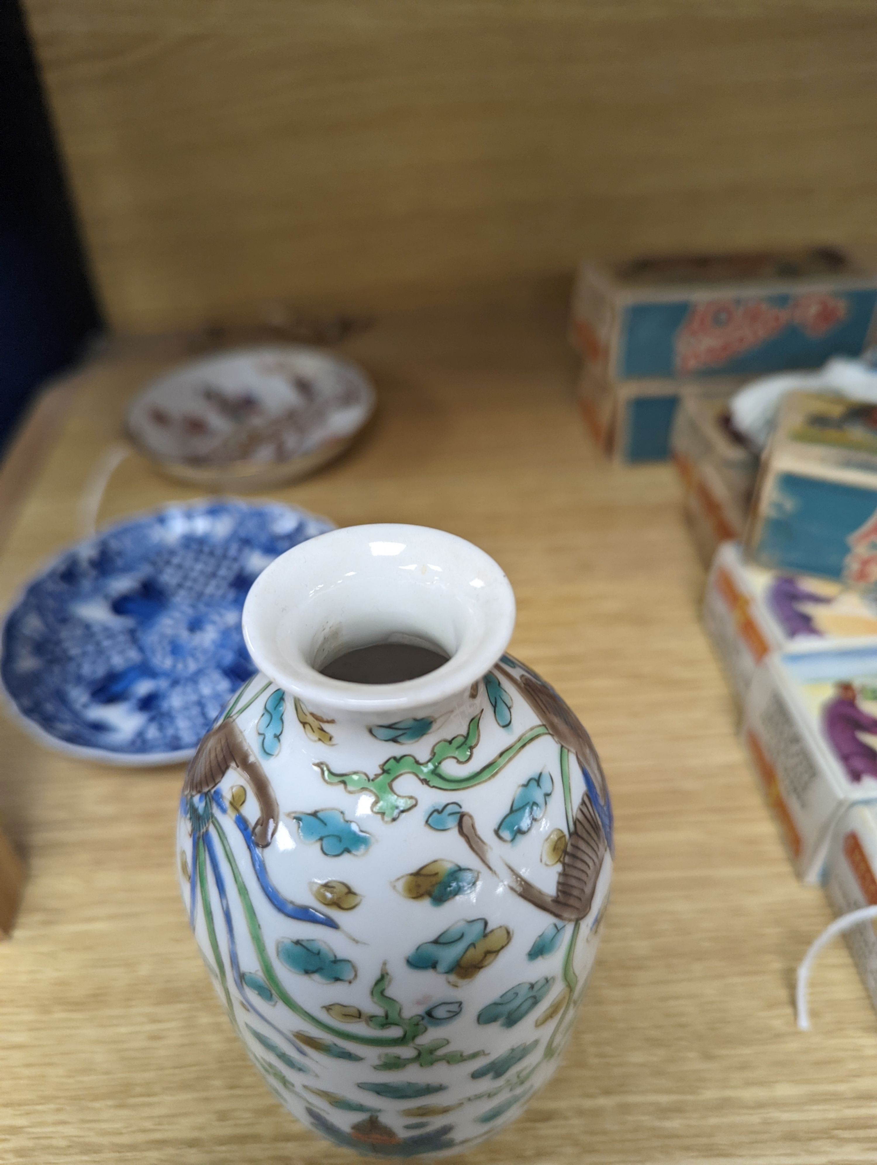 Two Chinese porcelain saucer dishes and an enamelled porcelain vase, 18th century and later, 12.5cm